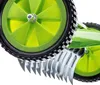 A close-up view of the wheels and tines of a manual lawn aerator. Produktbild-Vorschau