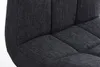A close-up view of the dark gray fabric upholstery of a bar stool. Náhled obrázku produktu