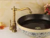 A close-up of a bathroom sink faucet and basin. Anteprima dell’immagine prodotto