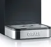 A close-up of the base of a coffee machine, showing the drip tray and the brand name. Produktbild-Vorschau