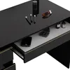 A close-up view of a black vanity table with gold accents, showing a drawer partially open with makeup and a phone inside. Náhled obrázku produktu
