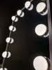 A close-up view of a string of LED lights, likely for a vanity mirror, against a dark background. Anteprima dell’immagine prodotto