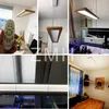 A collage of images showing a modern LED pendant light with a wooden frame in various settings, including a dining room and near an aquarium. One image shows a remote control. Náhľad obrázku produktu