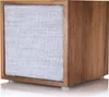 A close-up studio shot of a wooden cube speaker with a fabric front. Produktbild-Vorschau