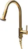 A gold kitchen faucet with a pull-out spray head is shown against a white background. Podgląd zdjęcia produktu