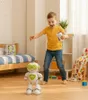 A young boy is playing with a remote-controlled robot in a bedroom. Anteprima dell’immagine prodotto