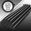 A stack of black hot glue sticks with a quality certification badge in the background. Voir les images du produit
