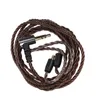 A coiled audio cable with a 3.5mm jack and two connector pins. Náhled obrázku produktu