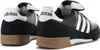 A pair of black Adidas Mundial Goal soccer shoes are shown from a rear-side angle. Anteprima dell’immagine prodotto