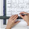 Hands using a drafting board with architectural plans. Náhľad obrázku produktu