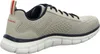 Side view of a beige athletic shoe. Voir les images du produit