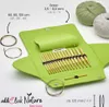 A knitting needle set and yarn are displayed on a white background. Produktbild-Vorschau