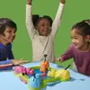 Three children are playing a board game. Podgląd zdjęcia produktu