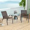 Two chairs and a small table on a wooden deck overlooking the water. Podgląd zdjęcia produktu