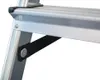 A close-up view of a ladder's aluminum step and support structure, showing a black strap attached with a metal fastener. Náhľad obrázku produktu