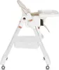 A side view of a white baby high chair with beige upholstery and rose gold accents. Náhled obrázku produktu