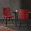 Two red chairs are placed around a wooden table in a dining room setting. Produktbild-Vorschau