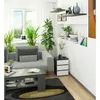A modern living room with a gray sofa, coffee table, and a nightstand next to it. The nightstand has three drawers and is gray and white. Produktbild-Vorschau