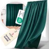 A close-up of a teal curtain with a ruffled top edge, displayed next to a window. A circular inset shows a wider view of the curtain hanging in a room. Several tags and certifications are visible. Produktbild-Vorschau