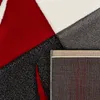 A close-up view of a rug with a geometric pattern and a visible backing. Produktbild-Vorschau