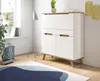 A modern white and wood secretary desk with a floor lamp and a backpack in a room. Produktbild-Vorschau