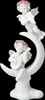 A white ceramic figurine of two cherubs playing musical instruments on a crescent moon. Produktbild-Vorschau