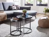A living room scene with a sectional sofa, nesting coffee tables, and a pouf. Anteprima dell’immagine prodotto