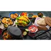 A spread of Mexican food and cooking utensils, including tacos, chips, salsa, and a tortilla press. Anteprima dell’immagine prodotto