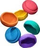 A collection of colorful balancing stones arranged in a scattered pattern. Voir les images du produit