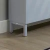 Close-up of the bottom corner of a gray cabinet with metal legs on a wooden floor. Náhled obrázku produktu