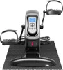 A black and silver mini exercise bike with a digital display and pedals, placed on a black textured mat. Produktbild-Vorschau