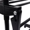 A close-up view of a black plastic and metal connector on a drying rack. Produktbild-Vorschau