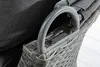 Close-up of the armrest and woven material of an outdoor chair. Produktbild-Vorschau