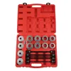 A red plastic case containing a set of bearing puller and installer tools. Produktbild-Vorschau