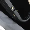 A close-up view of the metal frame and fabric of a bed, showing the connection points and fasteners. Produktbild-Vorschau
