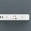 A close-up shot of a white power strip with multiple outlets and USB ports against a gray background. Podgląd zdjęcia produktu