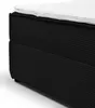 A close-up, studio shot of a black corduroy box spring bed frame with a white mattress topper. Voir les images du produit