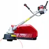 A gasoline-powered string trimmer (brush cutter) with a red protective guard and orange trimmer lines. Produktbild-Vorschau