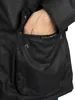 A person's hand is reaching into the pocket of a black jacket. Produktbild-Vorschau