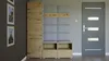 A hallway furniture set with a tall cabinet, a padded bench with coat hooks above, and shoe storage below, next to a grey door. Produktbild-Vorschau