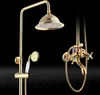A gold-colored shower set with a rain showerhead and a handheld showerhead, mounted on a black background with a water-like texture. Produktbild-Vorschau