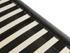 A close-up view of the wooden slats of a bed frame, with a dark gray fabric border visible. Podgląd zdjęcia produktu