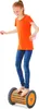 A young girl is standing on a balance roller. Náhled obrázku produktu