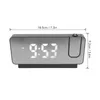 A digital alarm clock with a mirrored display and a projection feature, shown with dimensions indicated. Anteprima dell’immagine prodotto