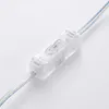 A close-up shot of a clear plastic inline switch on a white background. Produktbild-Vorschau