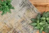 Szenebild: Teppich Pila ausgelegt auf hellem Holzboden.  Produktbild-Vorschau
