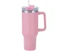 A pink insulated tumbler with a handle and straw, shown against a white background. Náhled obrázku produktu
