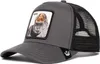 A charcoal gray trucker cap with a black mesh back and a patch featuring a gorilla with the word "BOSS" above it. Produktbild-Vorschau