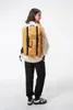A person wearing a backpack. Náhled obrázku produktu