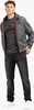 A man wearing a jacket and t-shirt, standing against a white background. Anteprima dell’immagine prodotto